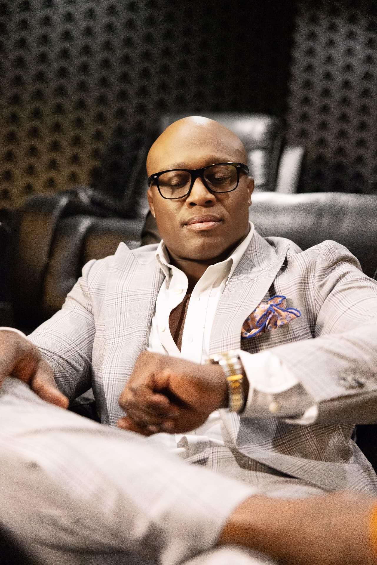 Bobby Lashley seated, adjusting his watch
